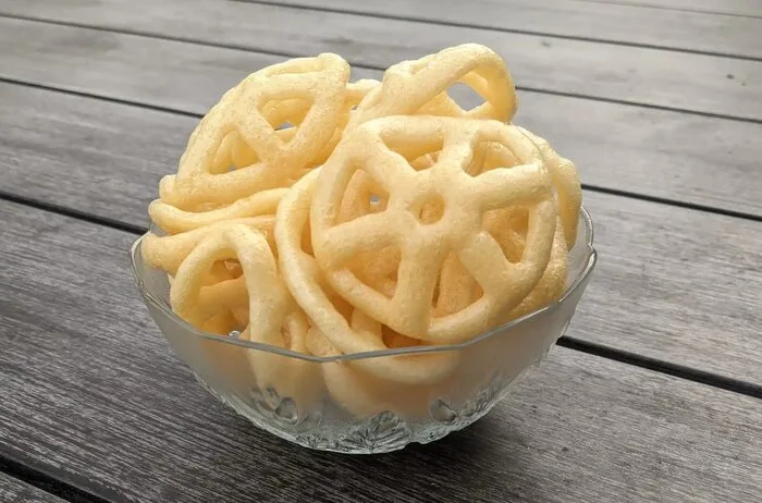 Bowl of golden fried Swirly's Classic Crunchies Fryums