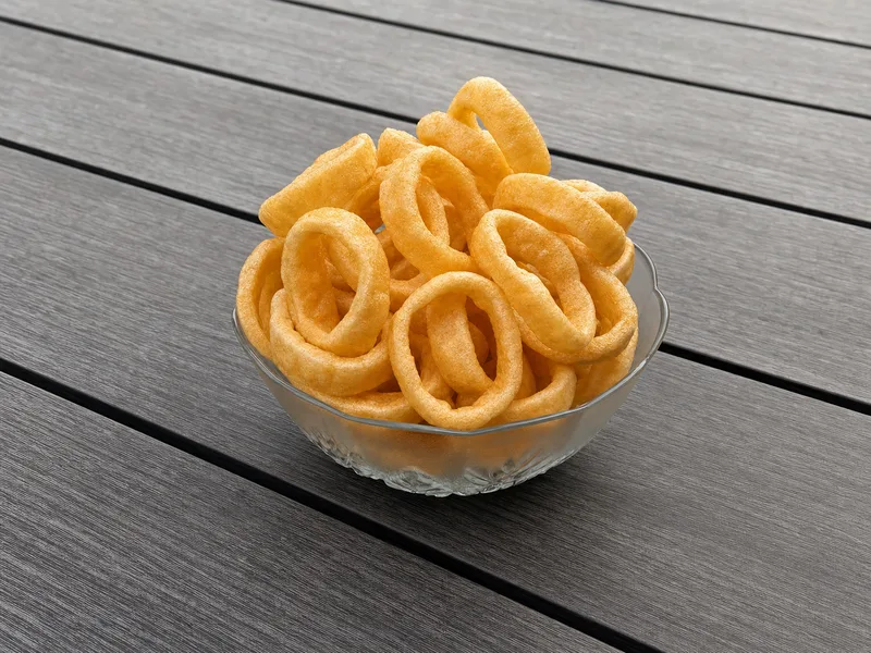 Bowl of golden fried Swirly's Ginger Garlic Rings Fryums